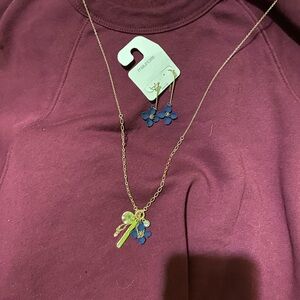 Matching set Dangling necklace with charms and blue flower with earrings